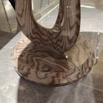 Round Sofa Side Table with Radial Natural Wood Veneer Top Sculptural Loop Pedestal and Circular Base